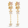 A pair of gold dangle earrings featuring butterfly and flower motifs, embellished with clear cubic zirconia stones and pink gemstones, set against a plain white background.