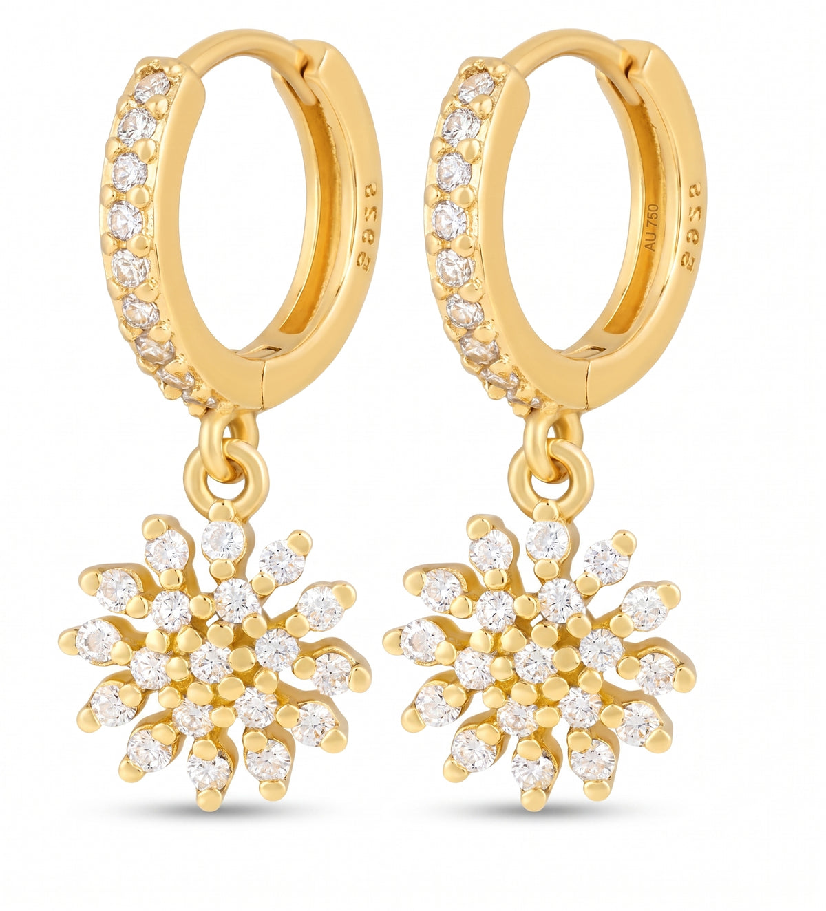 A pair of gold hoop earrings with pavé-set clear stones along the front and dangling snowflake-shaped charms, each adorned with small clear stones, shown on a white background.