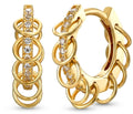 A pair of gold huggie hoop earrings with a multi-layered ring design and a central channel set with clear cubic zirconia stones, shown on a white background.
