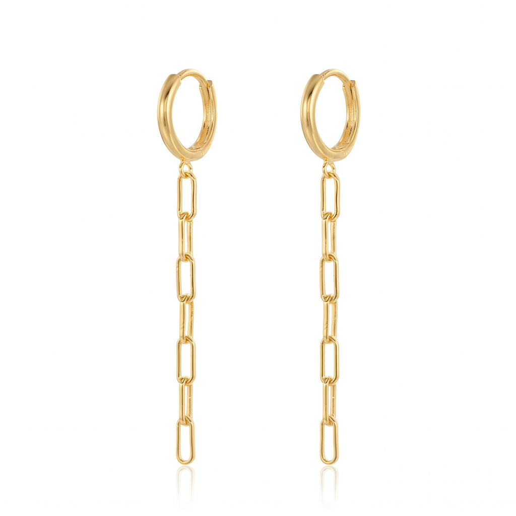 A pair of gold hoop earrings with a dangling paperclip chain, shown on a clean white background with a subtle reflection.