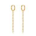 A pair of gold hoop earrings with a dangling paperclip chain, shown on a clean white background with a subtle reflection.
