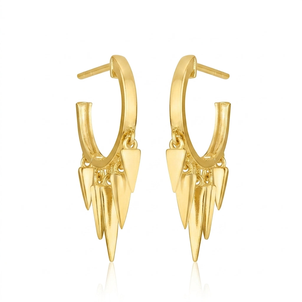 A pair of gold hoop earrings with dangling multi-pointed spike charms, shown on a clean white background with a subtle reflection.